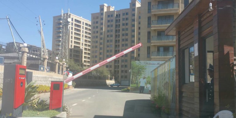 the main entrance to the apartment complex, security guards 24 seven